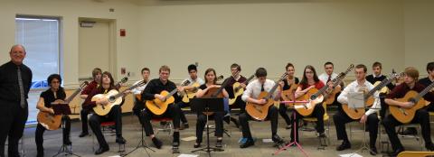 Picture of Dr. Kevin Vigil and students from Heritage High School